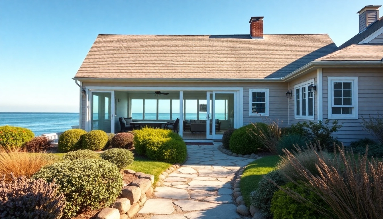 Cape Cod home addition featuring large windows and a scenic coastal garden.